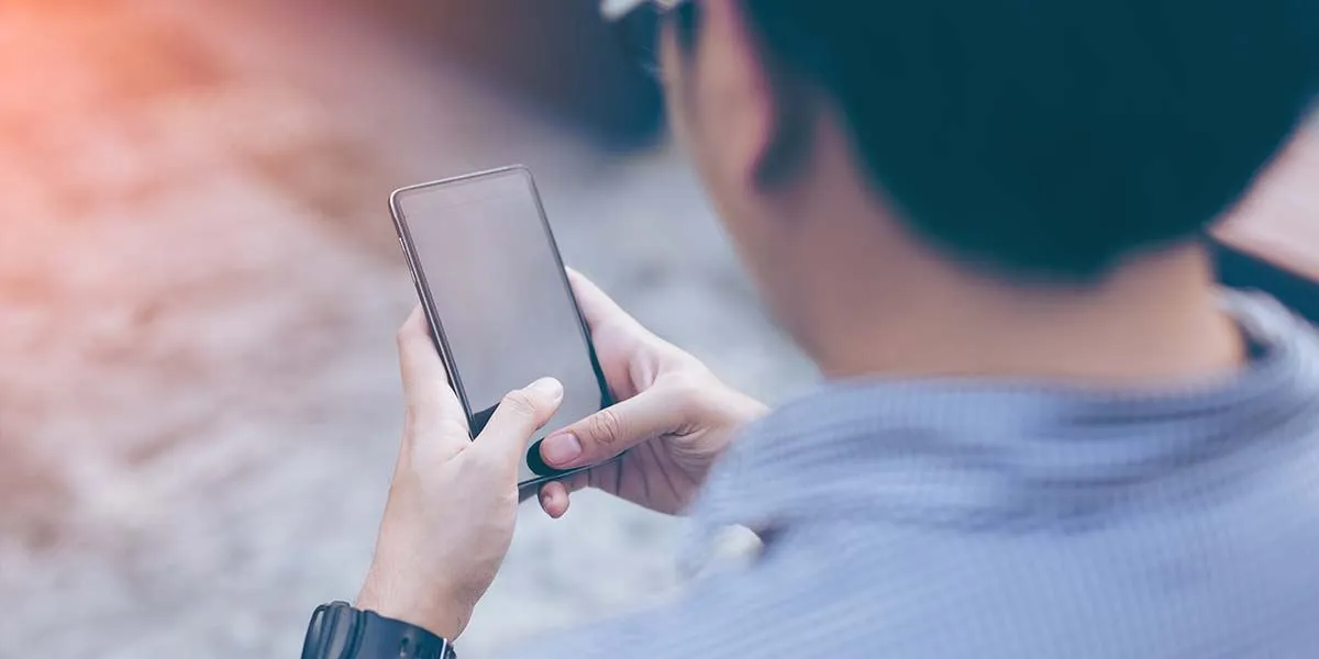 A person scrolling on a smartphone