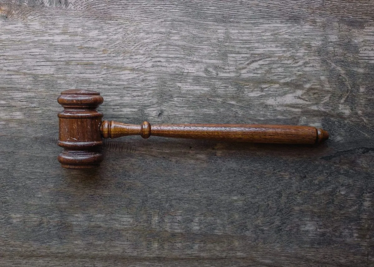 A judge’s gavel on a wooden desk