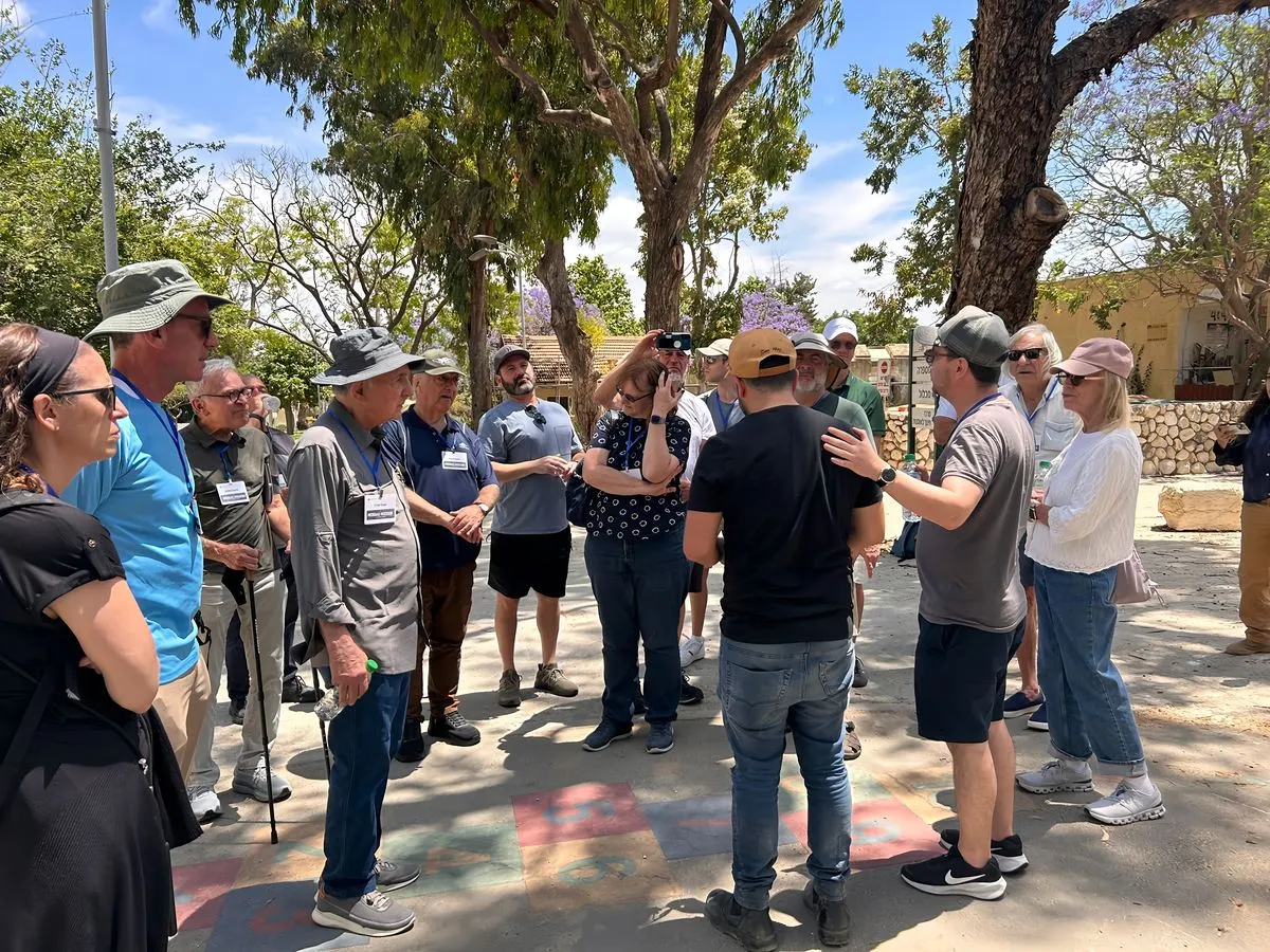 Participants on a One Day Mission gathered around their guide