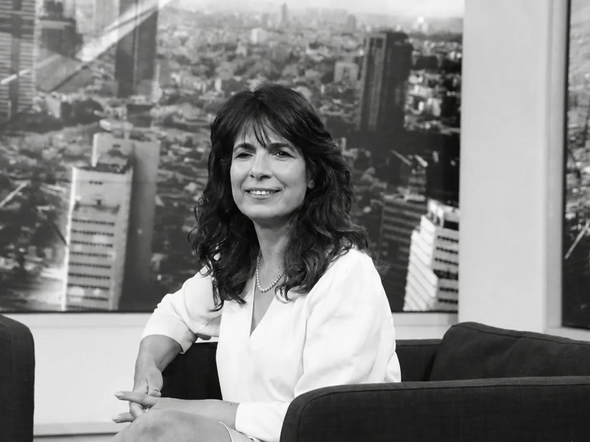 Nitsana Darshan-Leitner in an office, black-and-white portrait