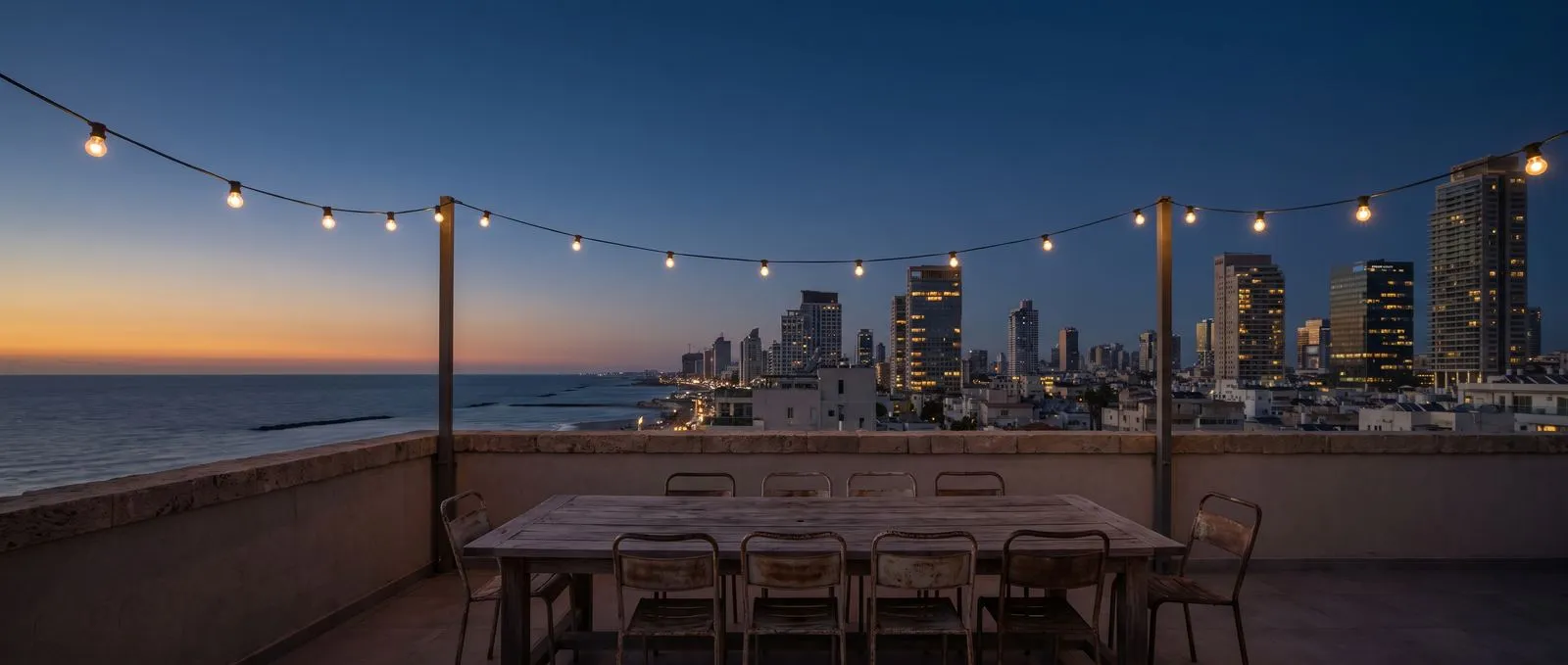 Illustration: the Tel Aviv skyline at dusk seen from an empty rooftop terrace